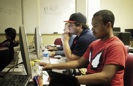 Alexander Roberts, junior computer science major, experiments on the computer in class. | Photo by Courtney Searcy